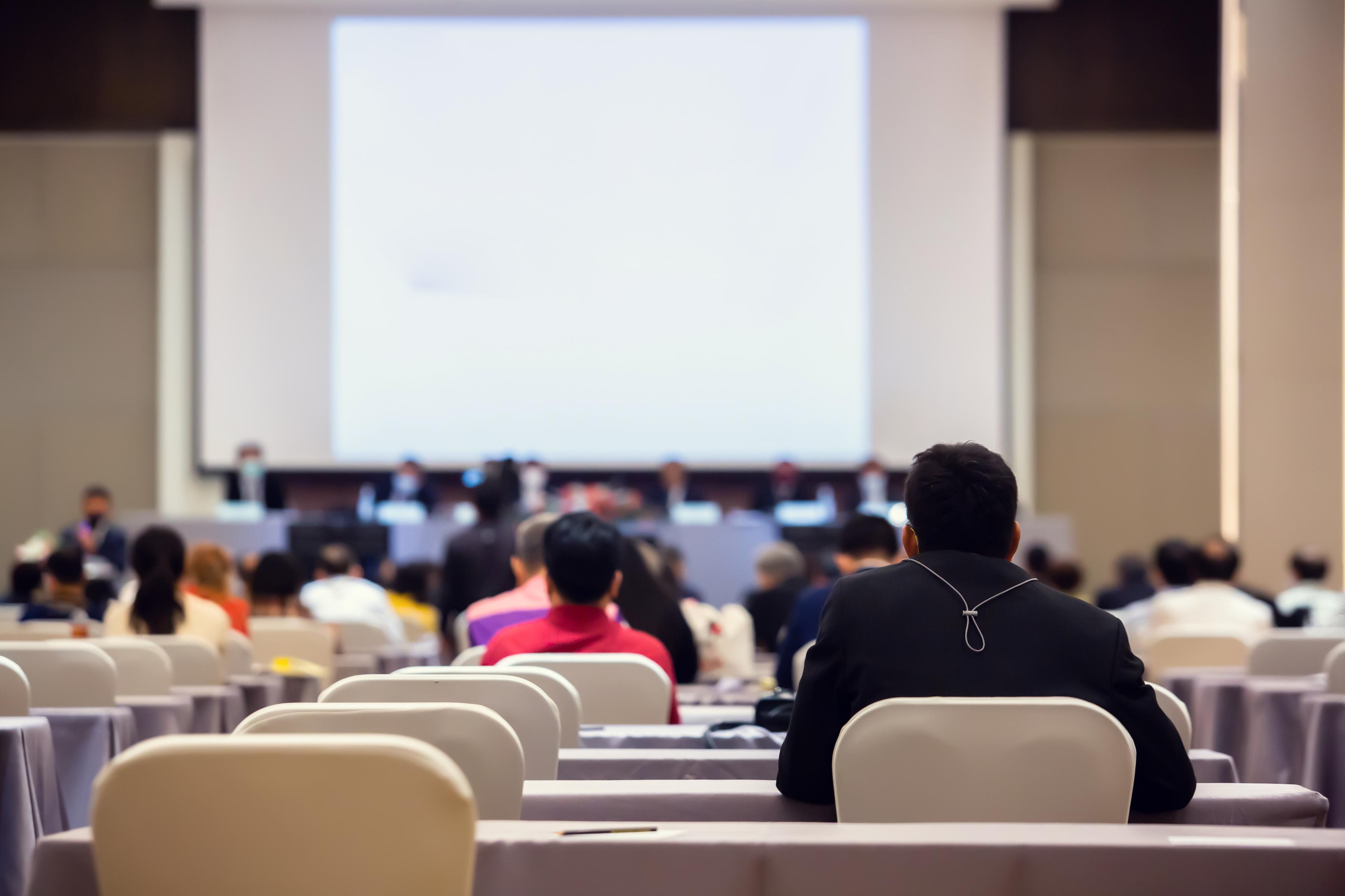 People listening to a conference